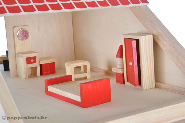 De slaapkamer met bed, wasbak en kast.